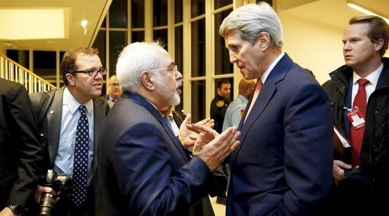 .S. Secretary of State John Kerry talks with Iranian Foreign Minister Javad Zarif after the IAEA verified that Iran has met all conditions under the nuclear deal, in Vienna