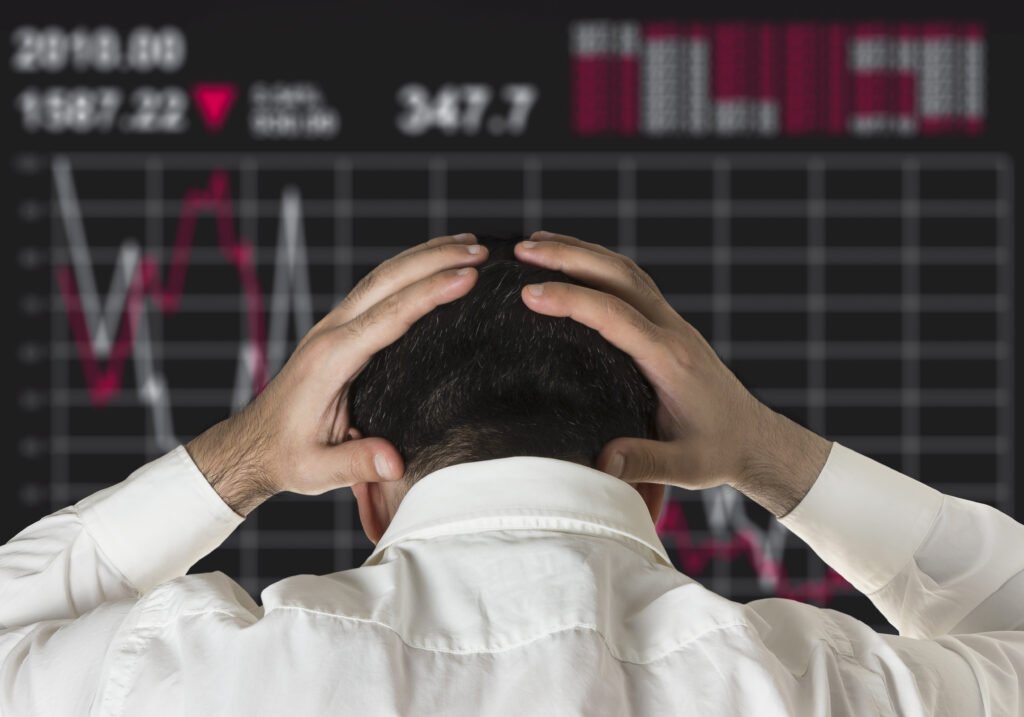 man sad by stock market crash