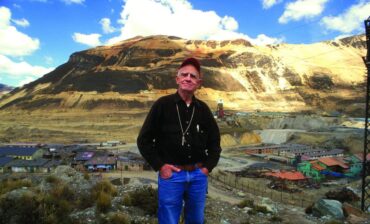 David Lowell posing in front of mountain