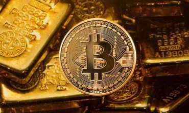 Bitcoin on top of gold bullion