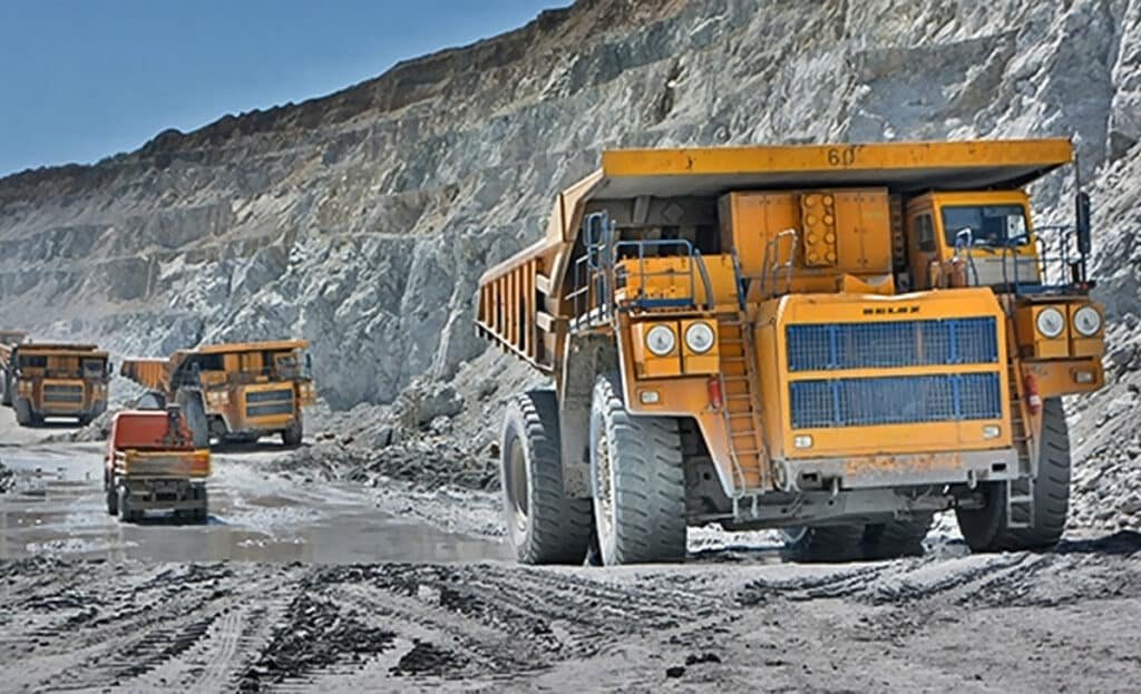 Big trucks in mining pit