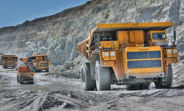 Big trucks in mining pit