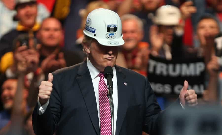 Trump wearing hard hat giving thumbs up